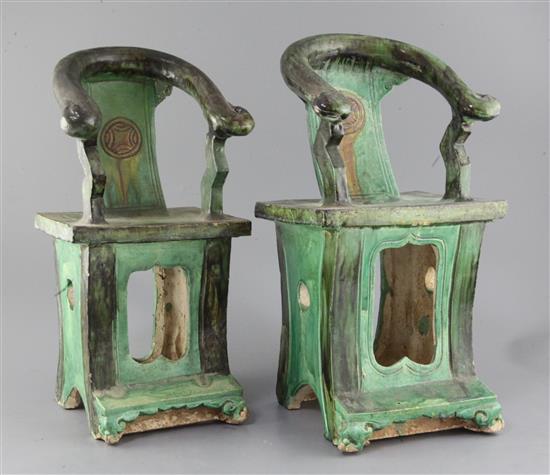 A near pair of Chinese sancai pottery models of horseshoe backed chairs, Ming dynasty, 41cm and 42cm